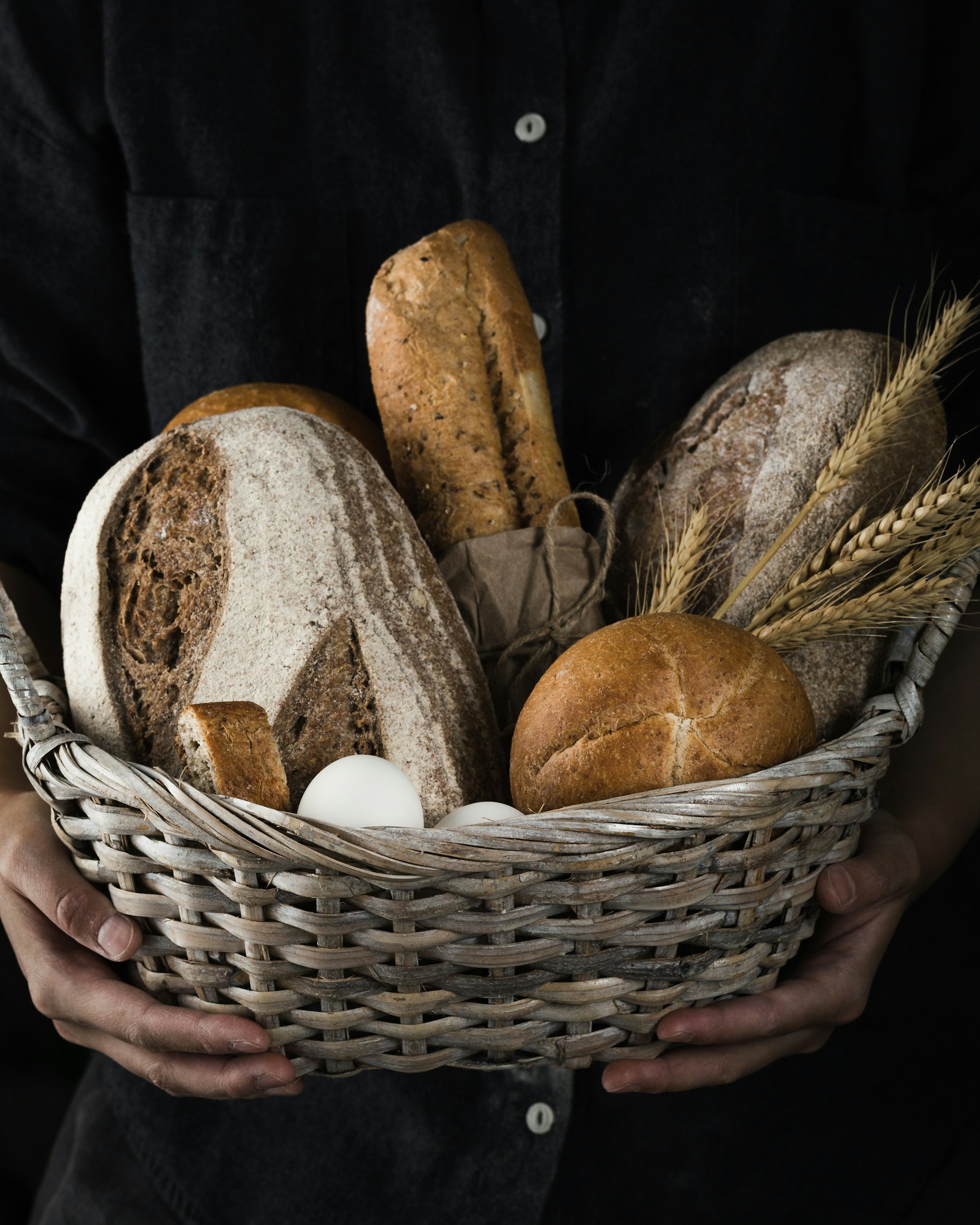 A wicker basket of mixed breads