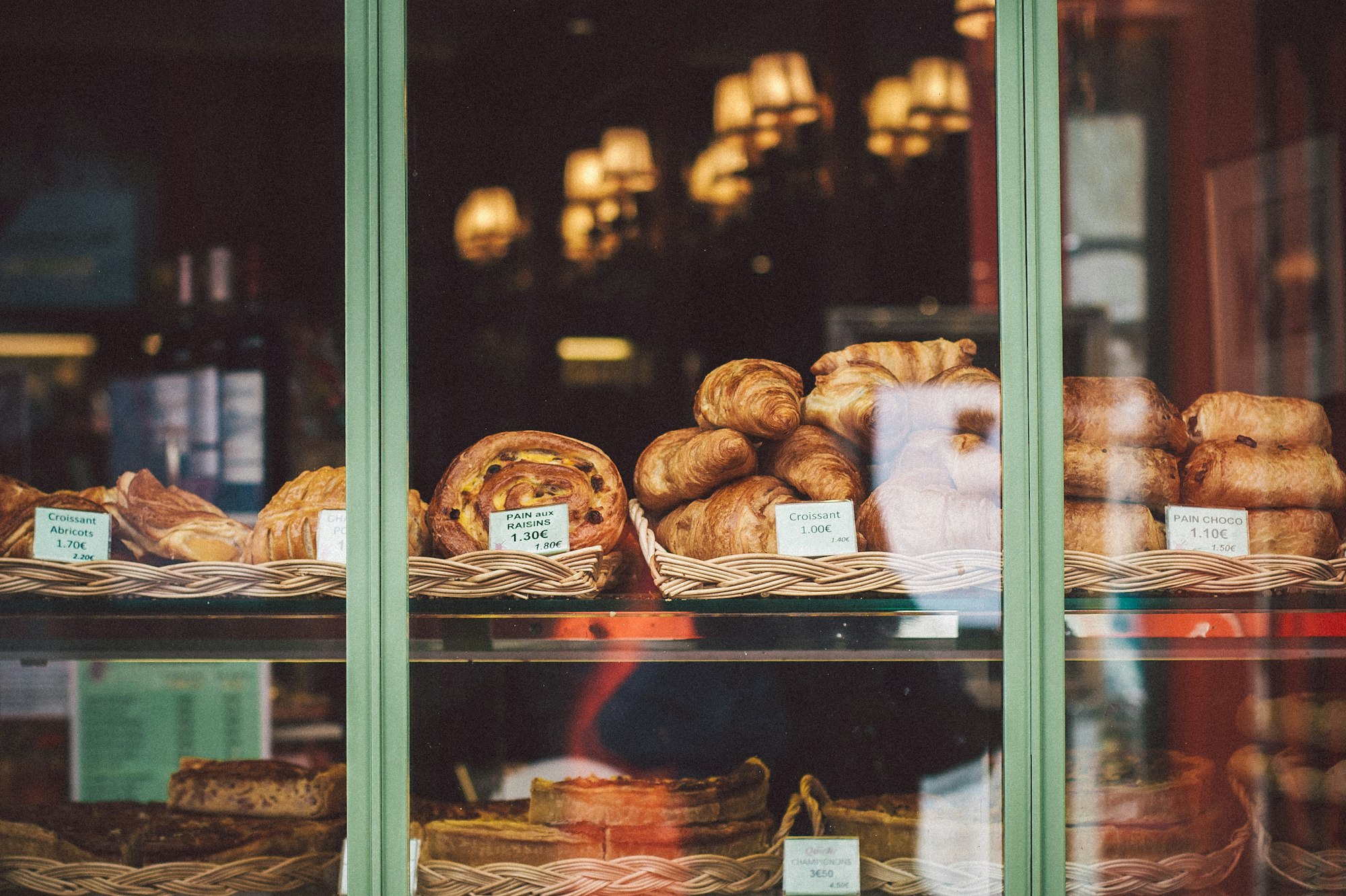 A window display of pastries and breads